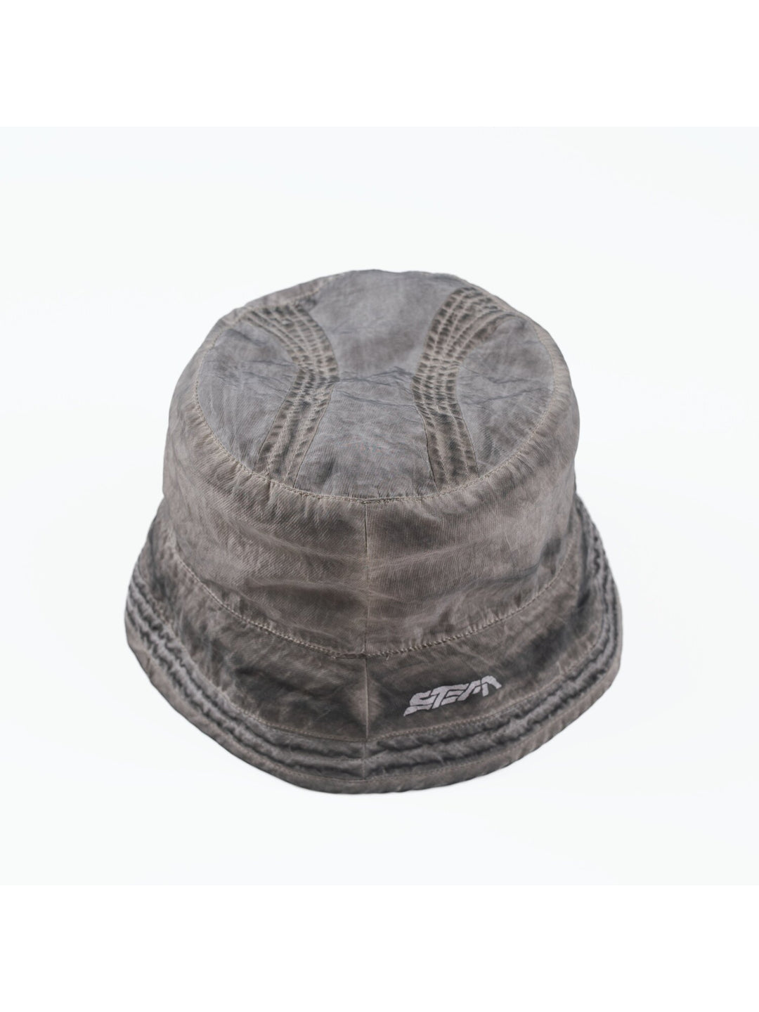 PIONEER distressed nylon bucket hat in moon dust gray — overhead garment-only view of the crown panels