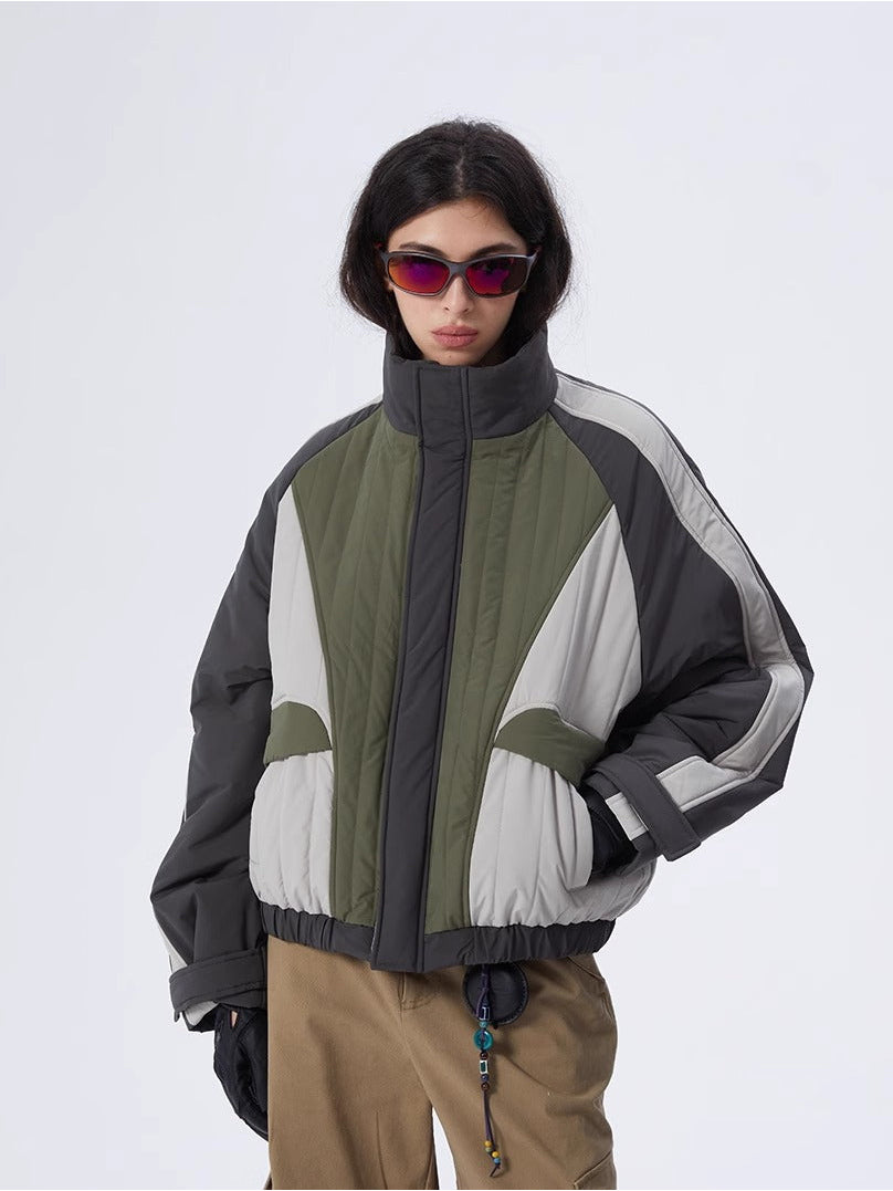 ERRORCODE ROBOT gray, white and green colorblock quilted cropped jacket, front modeled view with hands at the hips