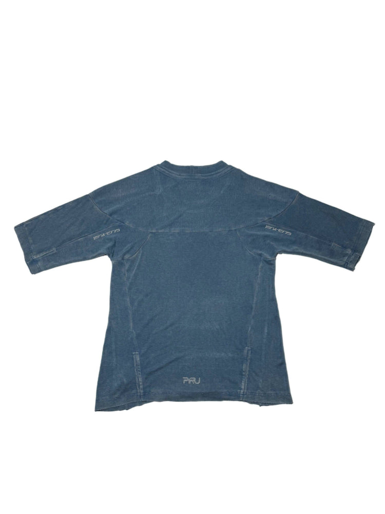 LIGHTSHADOW mycelium blue deconstructed technical tee — blue back flat-lay showing reflective sleeve and hem logos