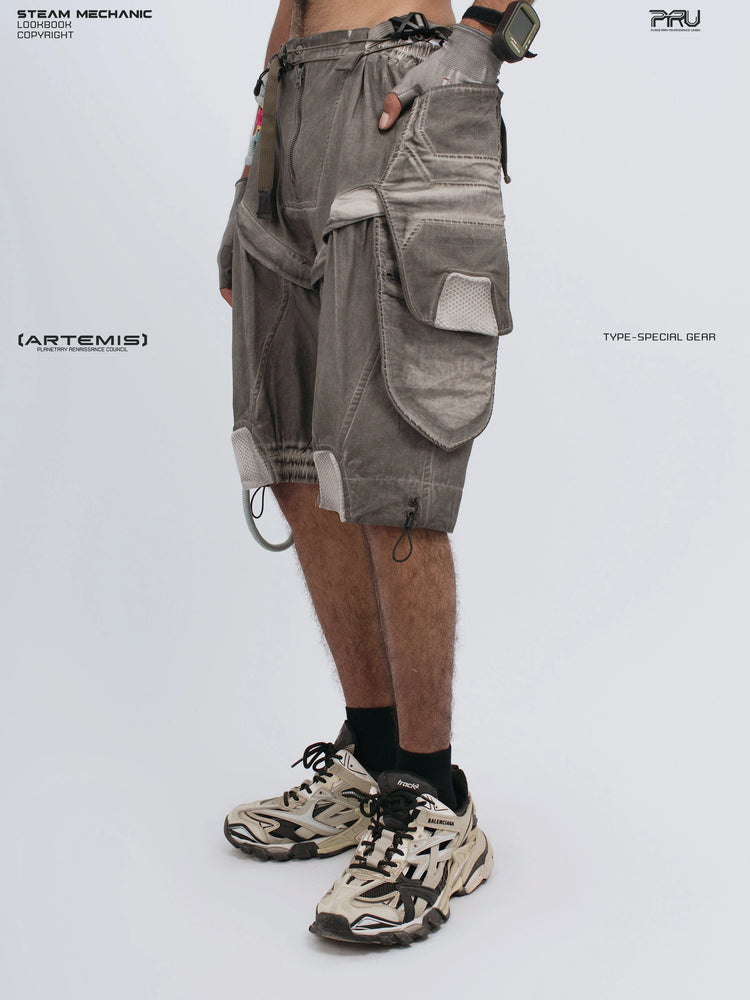 ARTEMIS xirang brown detachable technical shorts — three-quarter front view with hand in cargo pocket