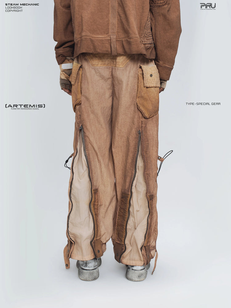 STARCORE venus orange engineer utility pants — back modeled view with the leg zippers open