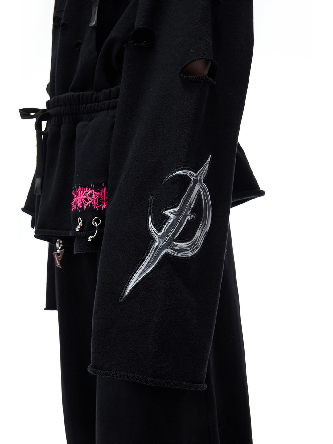 PINKSPINK MOHAWK RITUAL studded zip-up hoodie — sleeve graphic and distressed fabric close-up