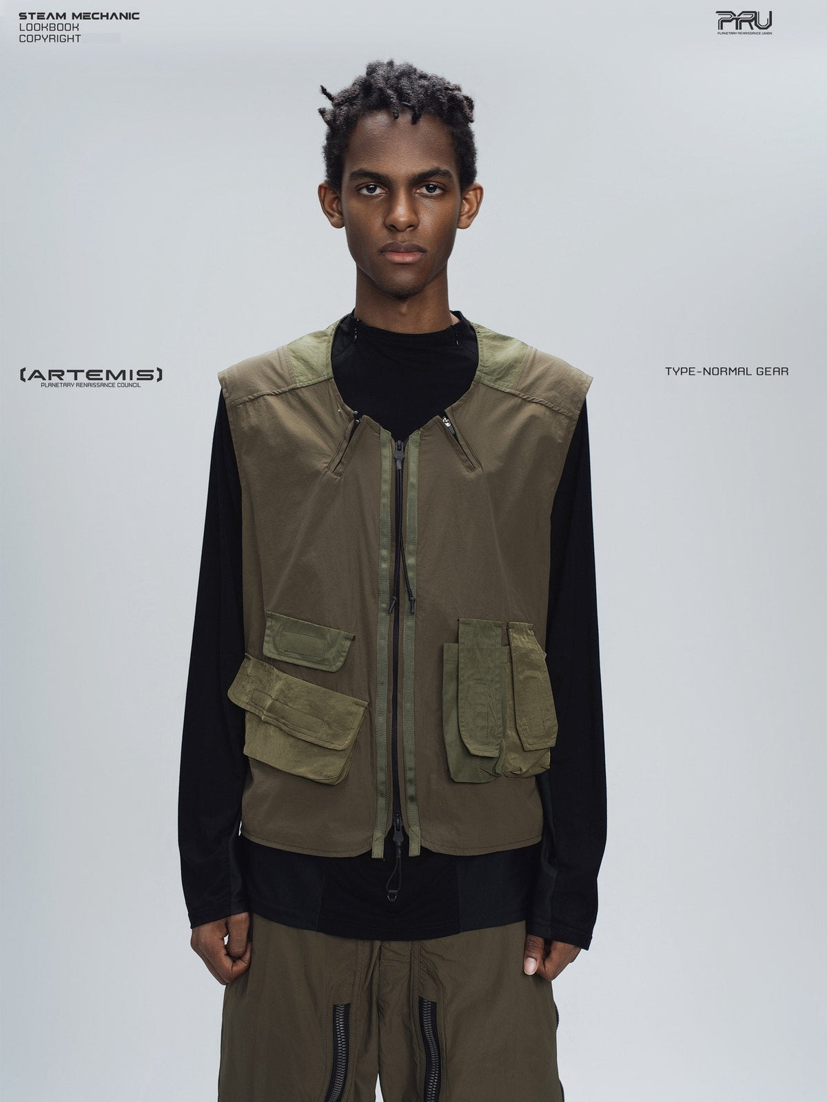 CLERIC utility nylon vest in vine gray green — front modeled close-up showing olive panels and asymmetric pockets