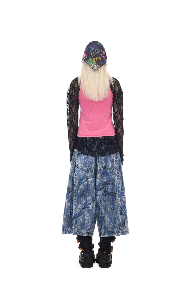 PINKSPINK ELECTRIC MOON lace-coated wide-leg denim shorts in blue — full-length back modeled view with a pink top and black lace sleeves