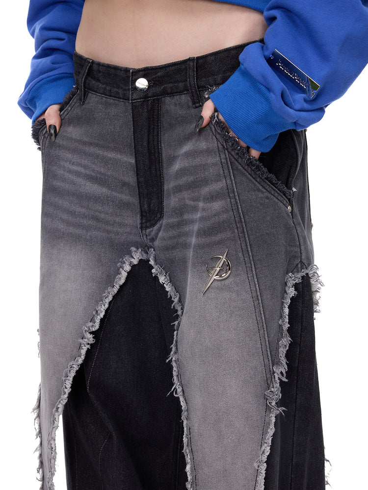 PINKSPINK ELECTRIC MOON reconstructed wide-leg jeans — front detail of layered gray and black denim