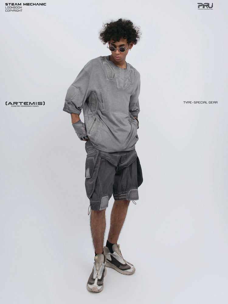 STARCORE moon dust gray distressed mesh tee — full-length angled front view with hands in pockets and head lowered