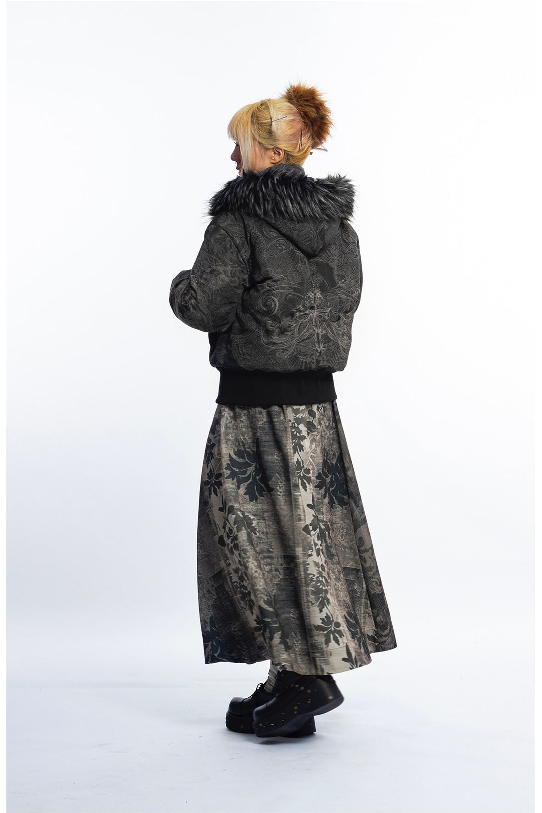 4RE1GN GOTHIC down jacket in charcoal ornamental print — Full-body back three-quarter view showing hood and ribbed hem.