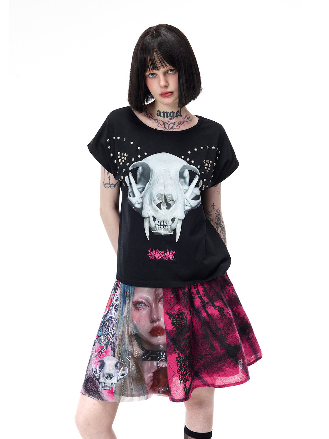 PINKSPINK CATACOMB reversible cat-skull tee in black — close cat-skull modeled view with head tilted and arms behind