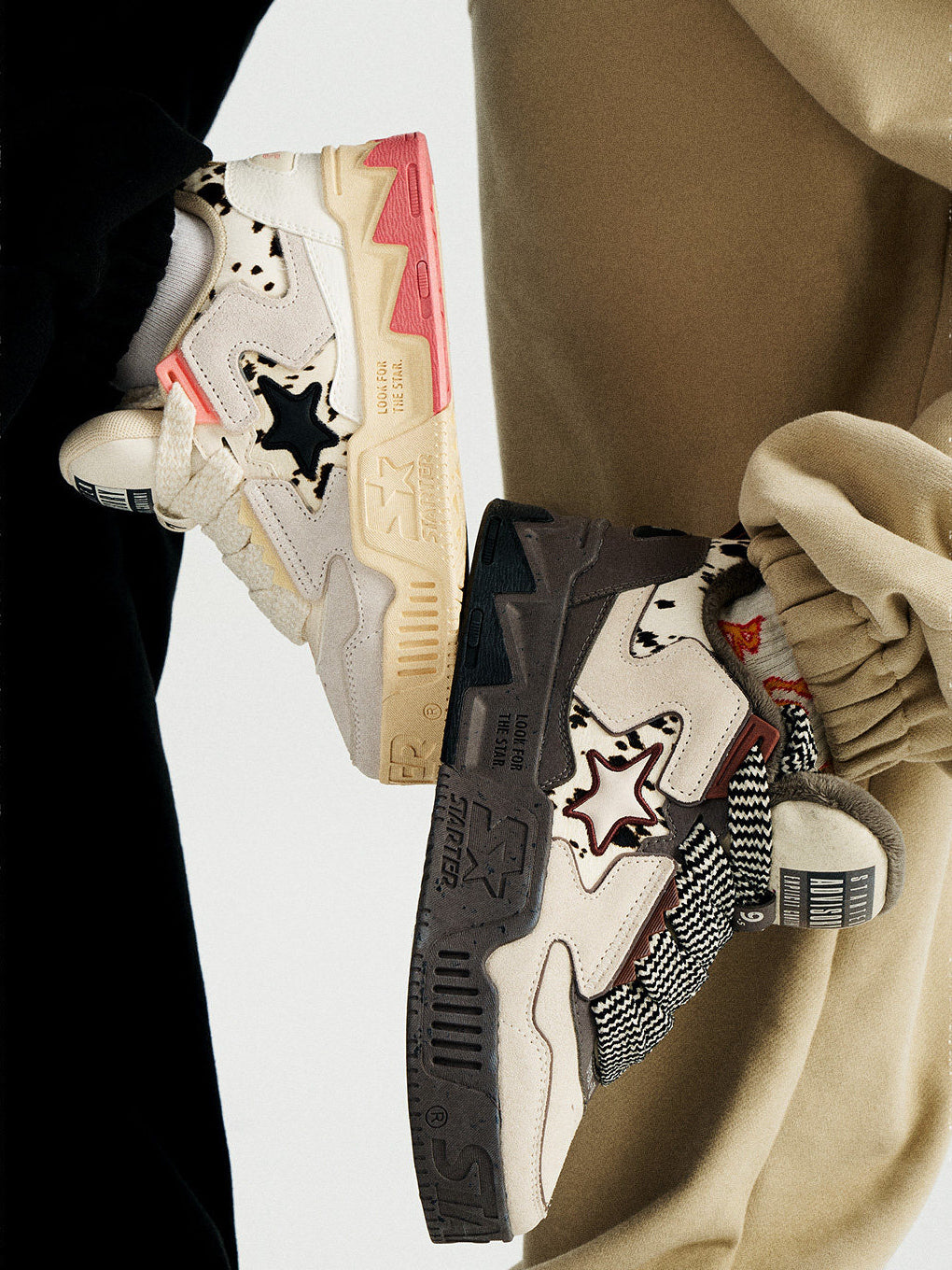 STARTER ZOO Cow Pink sneaker on the left beside a separate Zebra Gray design in an on-foot side view