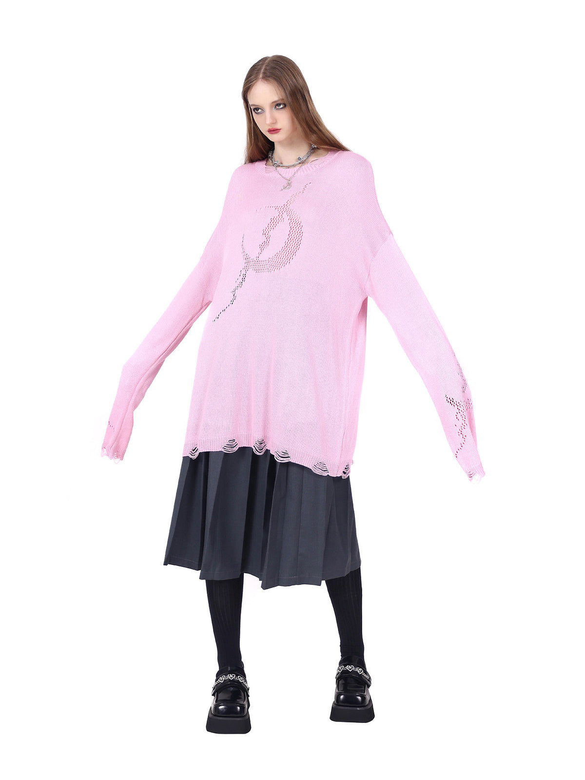PINKSPINK ELECTRIC MOON distressed open-knit sweater in pink — front view with arms extended to show sleeve length and loose proportions