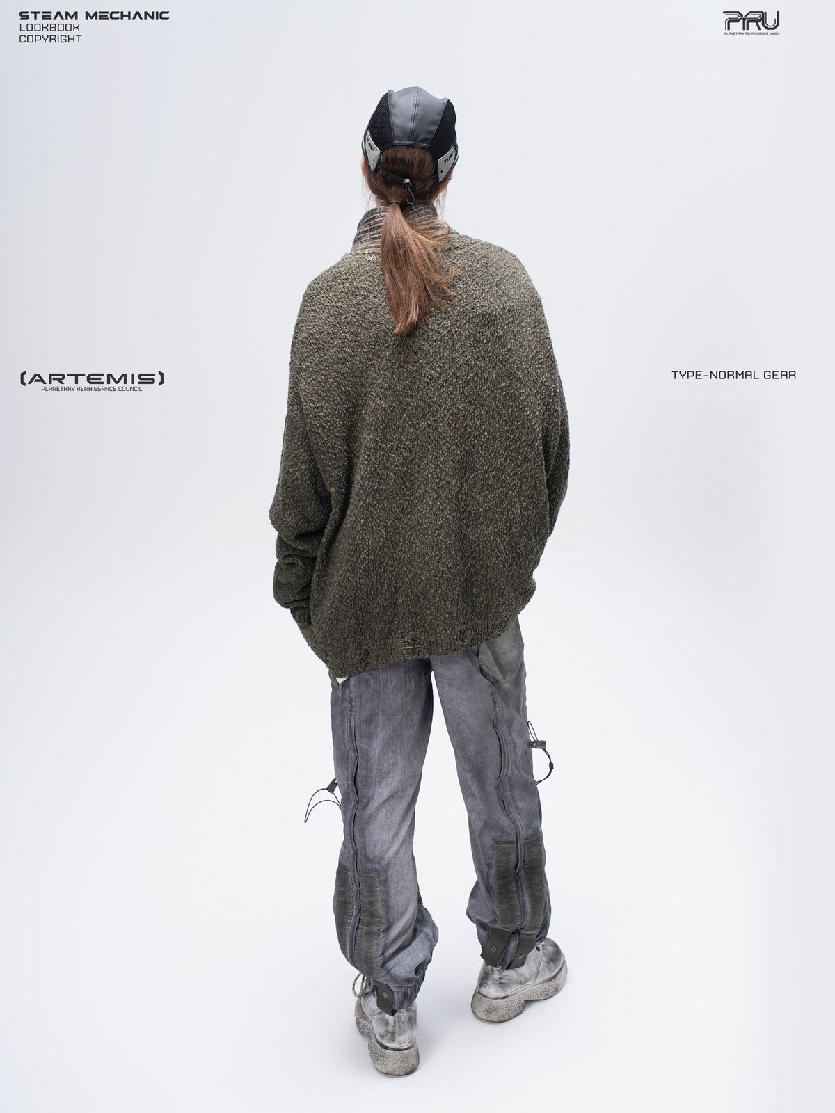 PIONEER tundra green moon-protection distressed sweater — full-length rear three-quarter modeled view showing the loose textured silhouette
