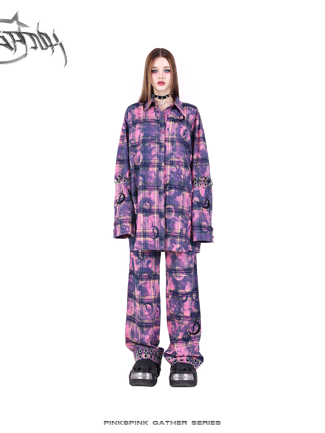 PINKSPINK ELECTRIC MOON wasteland plaid straight-leg pants — modeled detail view of the garment construction