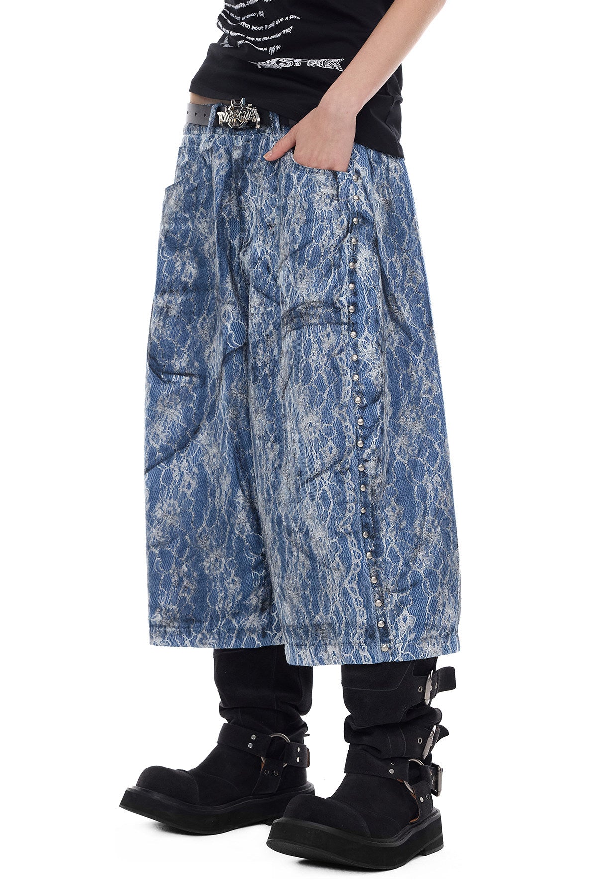 PINKSPINK ELECTRIC MOON lace-coated wide-leg denim shorts in blue — close angled front view with a hand in the oversized pocket
