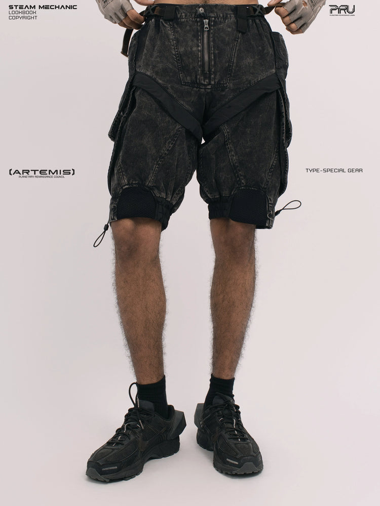 ARTEMIS blackbird black detachable technical shorts — front view with gloved hands at the waist