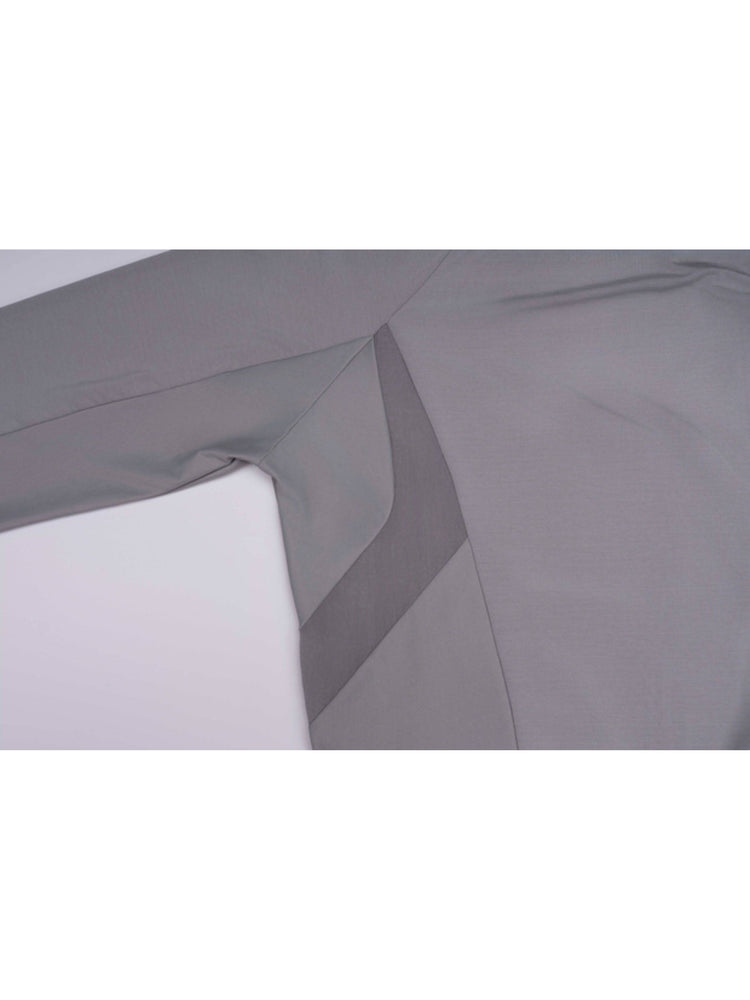 ARTEMIS moon dust gray stretch technical base-layer top — moon dust gray curved side-panel and underarm seam close-up