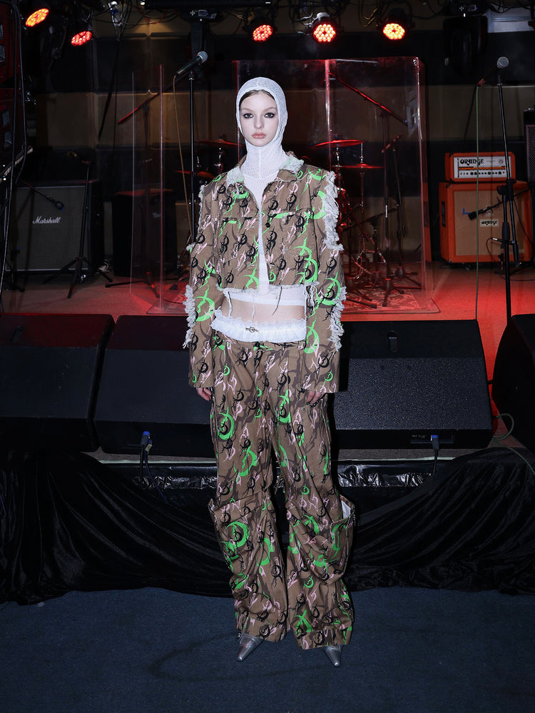 PINKSPINK ELECTRIC MOON distressed camo cropped jacket in CAMOUFLAGE — full-body front view with a white mesh underlayer.