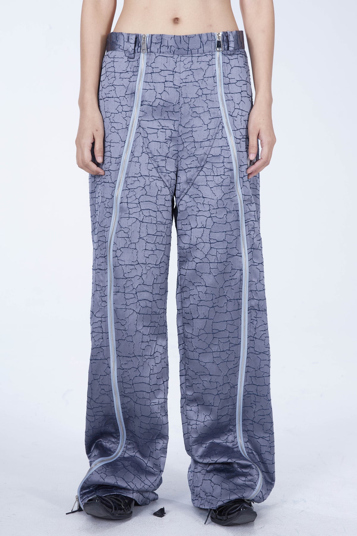 EMBRYO FIVE POISONS luminous-zip crackle flare pants — rear modeled view