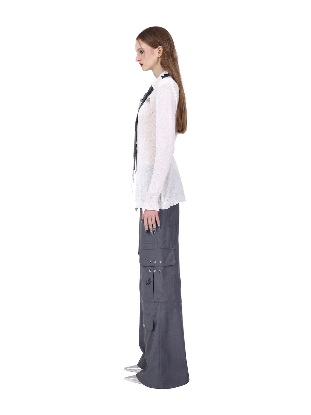 PINKSPINK ELECTRIC MOON ring-fastened sequin knit shirt in white — full-length side view styled with gray cargo trousers