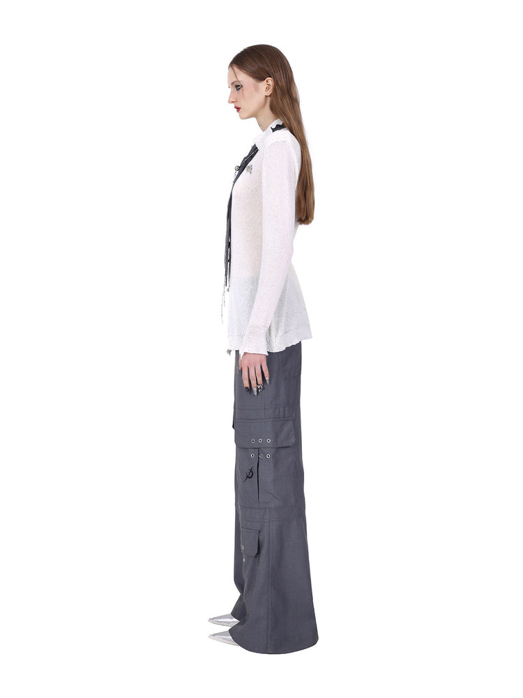 PINKSPINK ELECTRIC MOON ring-fastened sequin knit shirt in white — full-length side view styled with gray cargo trousers