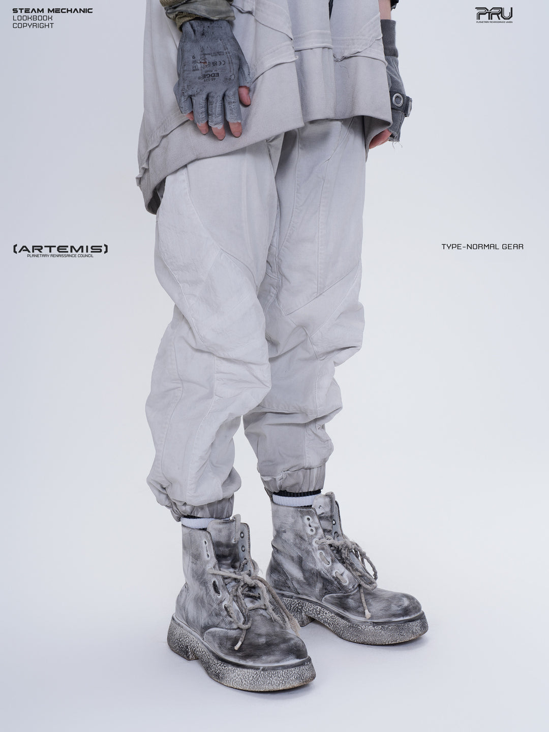 AEGIS eris white cropped moto riding pants — opposite front three-quarter close-up showing the curved knee panels