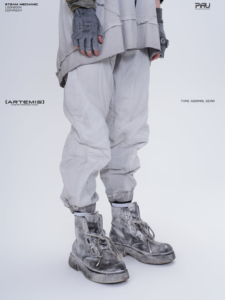 AEGIS eris white cropped moto riding pants — opposite front three-quarter close-up showing the curved knee panels
