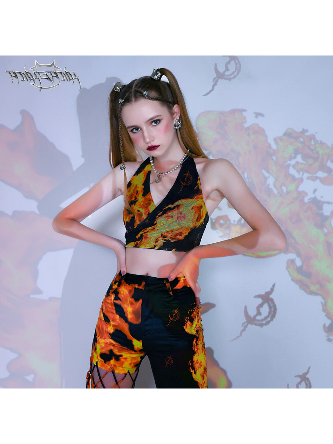PINKSPINK FLAME halter crop top — black flame-print halter top, front modeled hero view