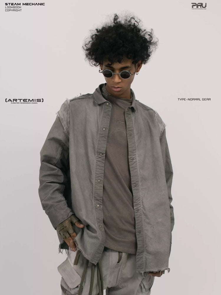 CHAOS ERA moon dust gray raw-edge technical shirt — front three-quarter modeled view looking down