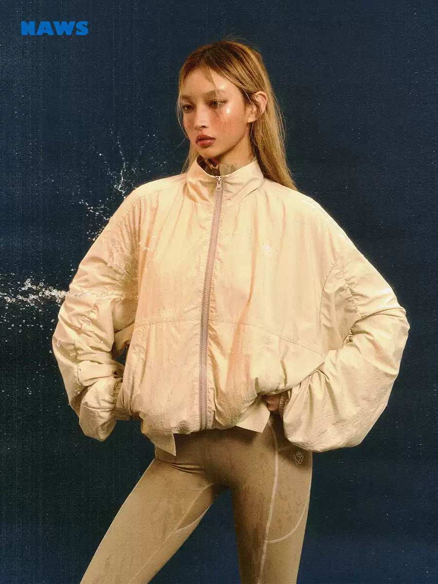 NAWS CLOUD softshell running jacket — close modeled view highlighting the construction