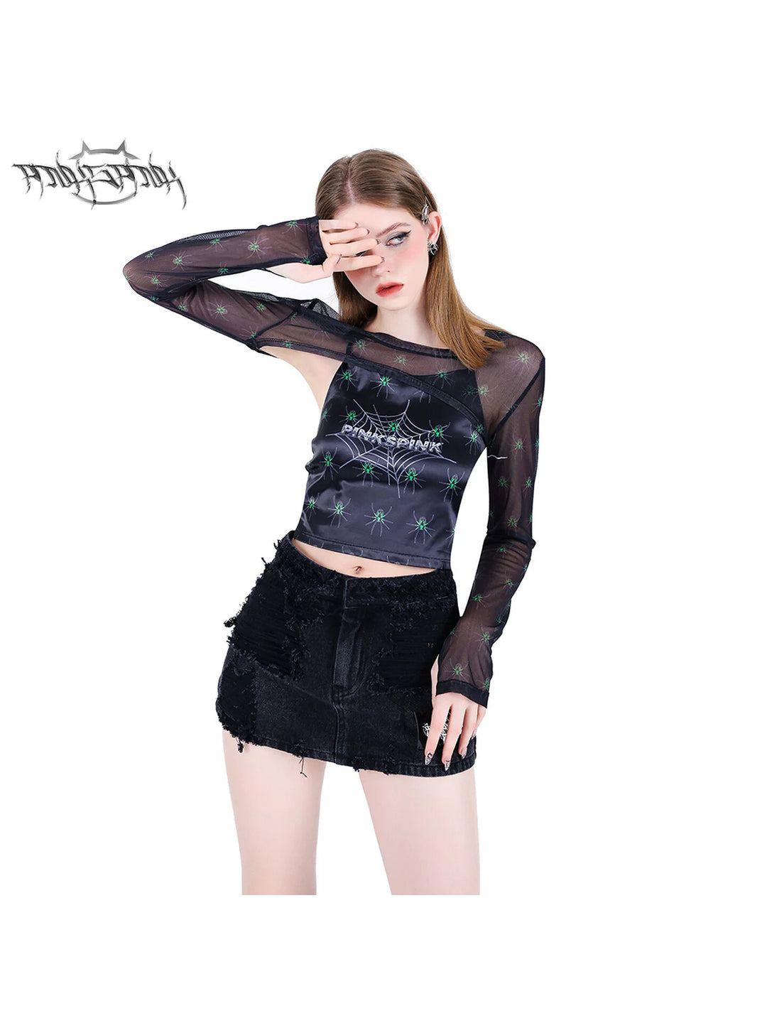 PINKSPINK SPIDER web-mesh long-sleeve shrug — front modeled view with one arm raised showing the sheer spider-print sleeves