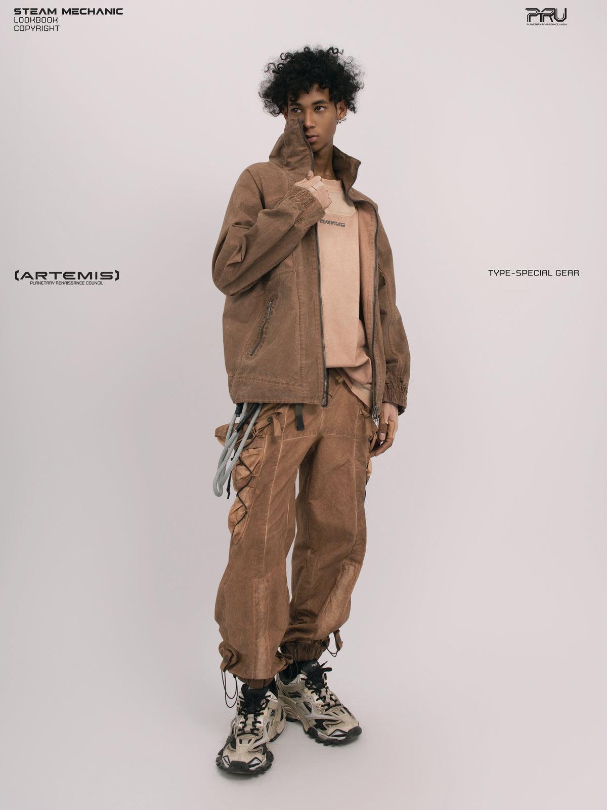 ARTEMIS soft dawn orange tuck-paneled technical jacket — full-length three-quarter modeled view with one hand at collar
