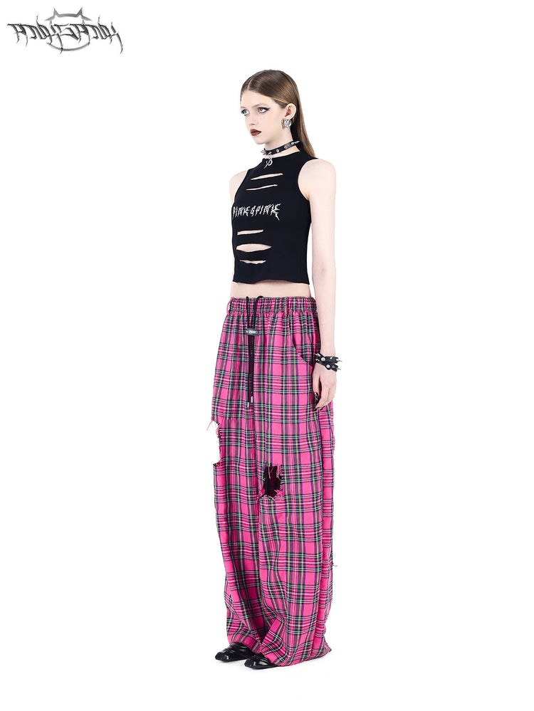 PINKSPINK PINK RIOT distressed plaid wide-leg pants — pink plaid angled front view with black cropped top