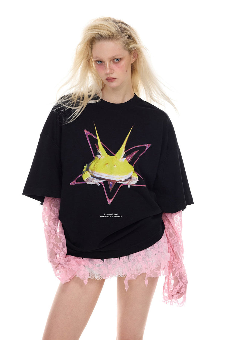 PINKSPINK HORNED FROG oversized graphic tee in black — front modeled close-up showing the frog graphic