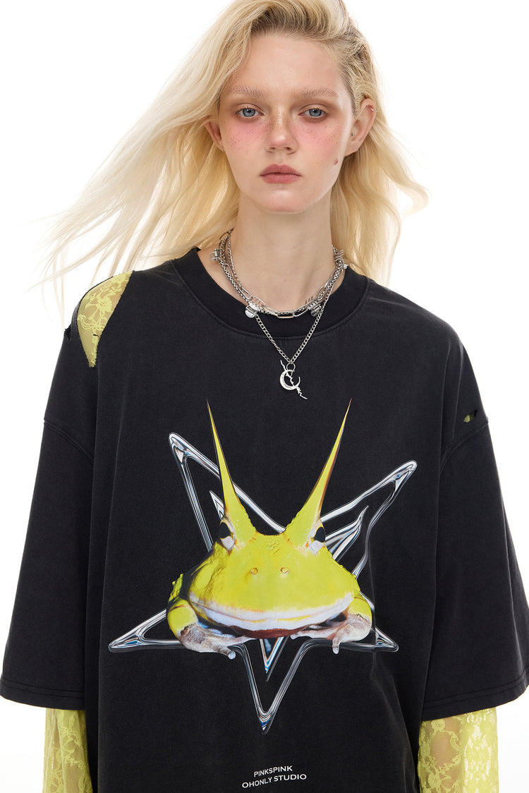 PINKSPINK HORNED FROG distressed graphic tee in black — front close-up of the frog graphic, neckline and shoulder tear