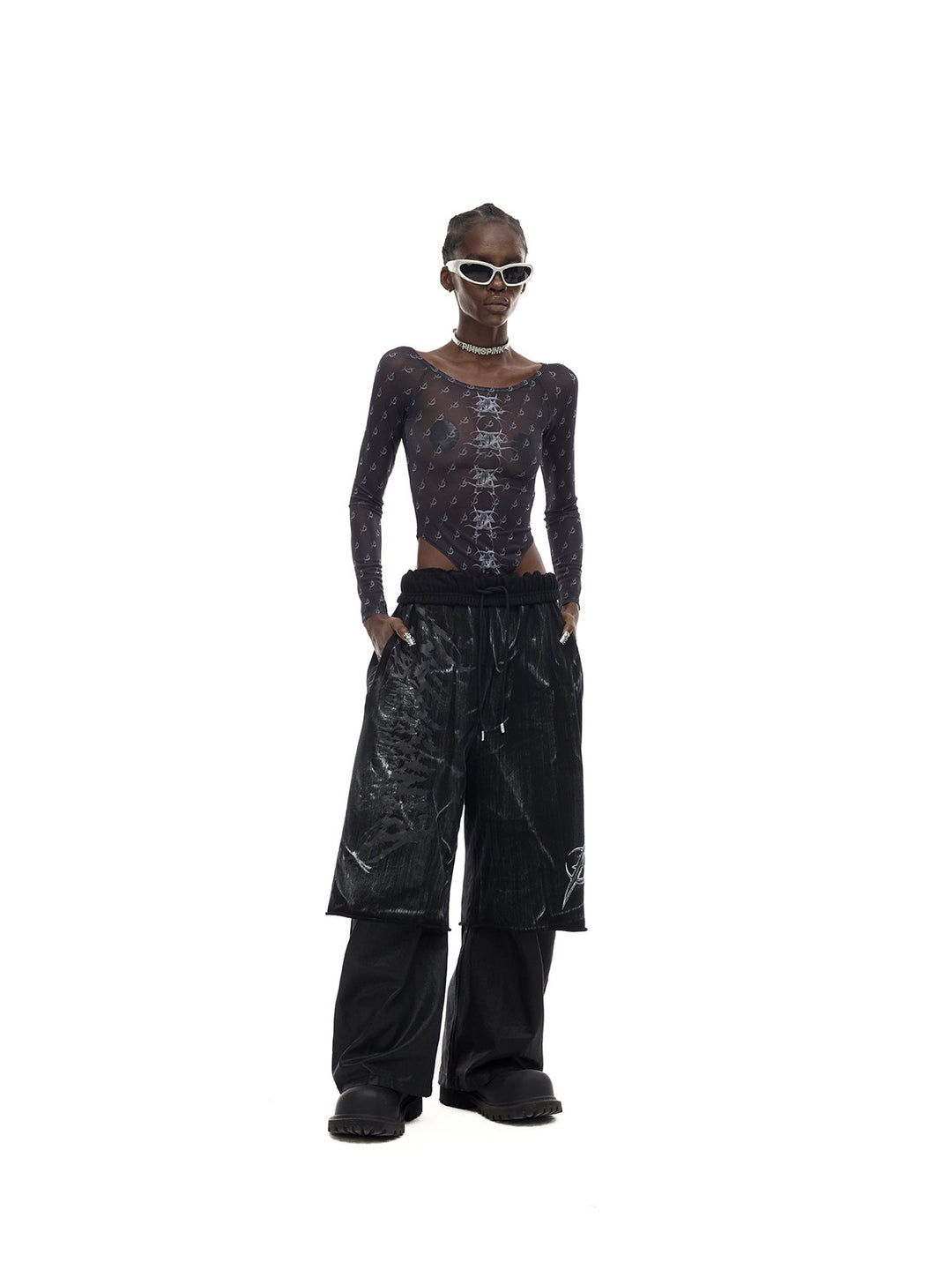 PINKSPINK MIRROR graphic mesh bodysuit in black — front full-length modeled view with a wider stance