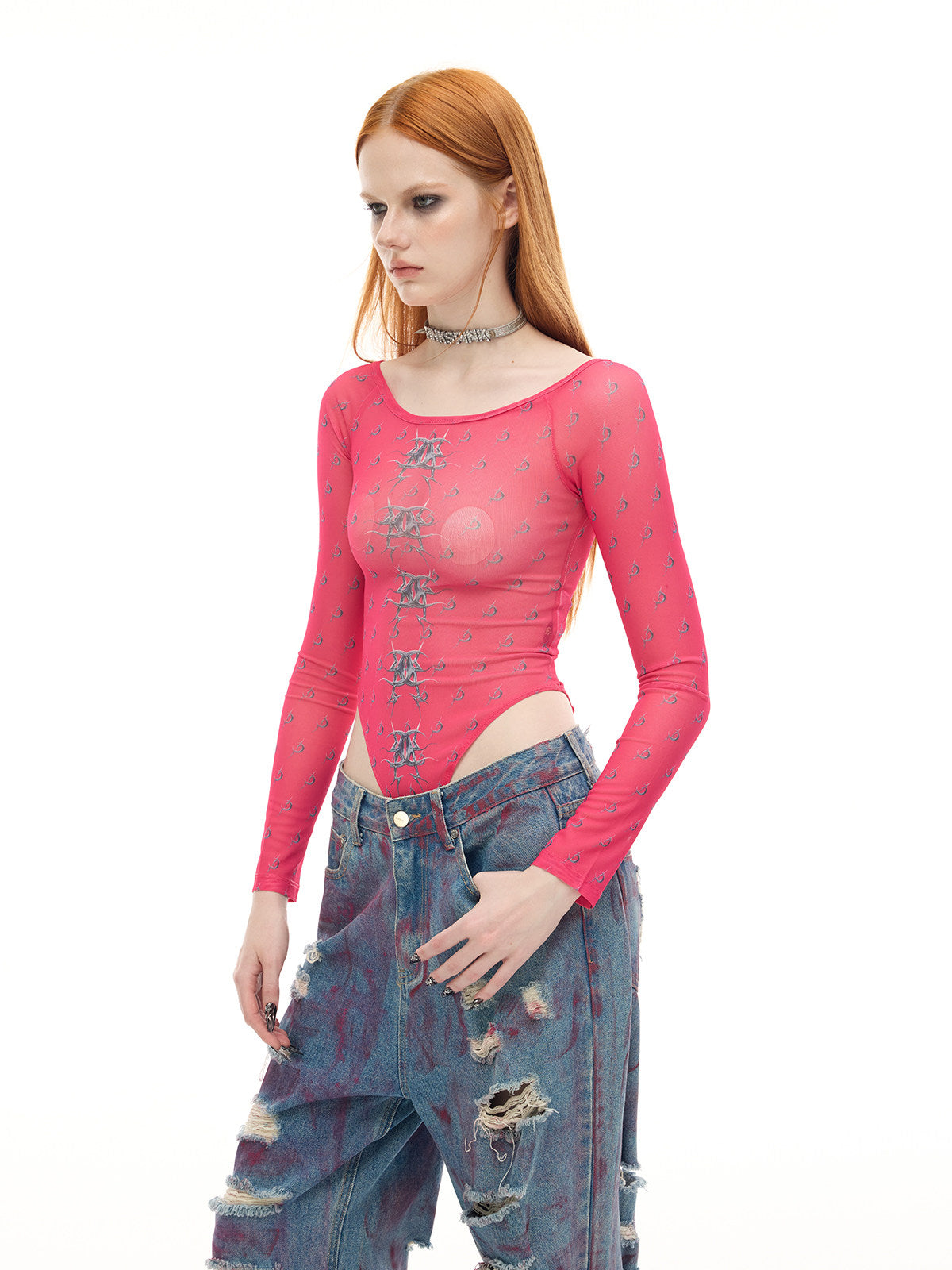 PINKSPINK MIRROR graphic mesh bodysuit in pink — three-quarter modeled close-up showing the mesh and print