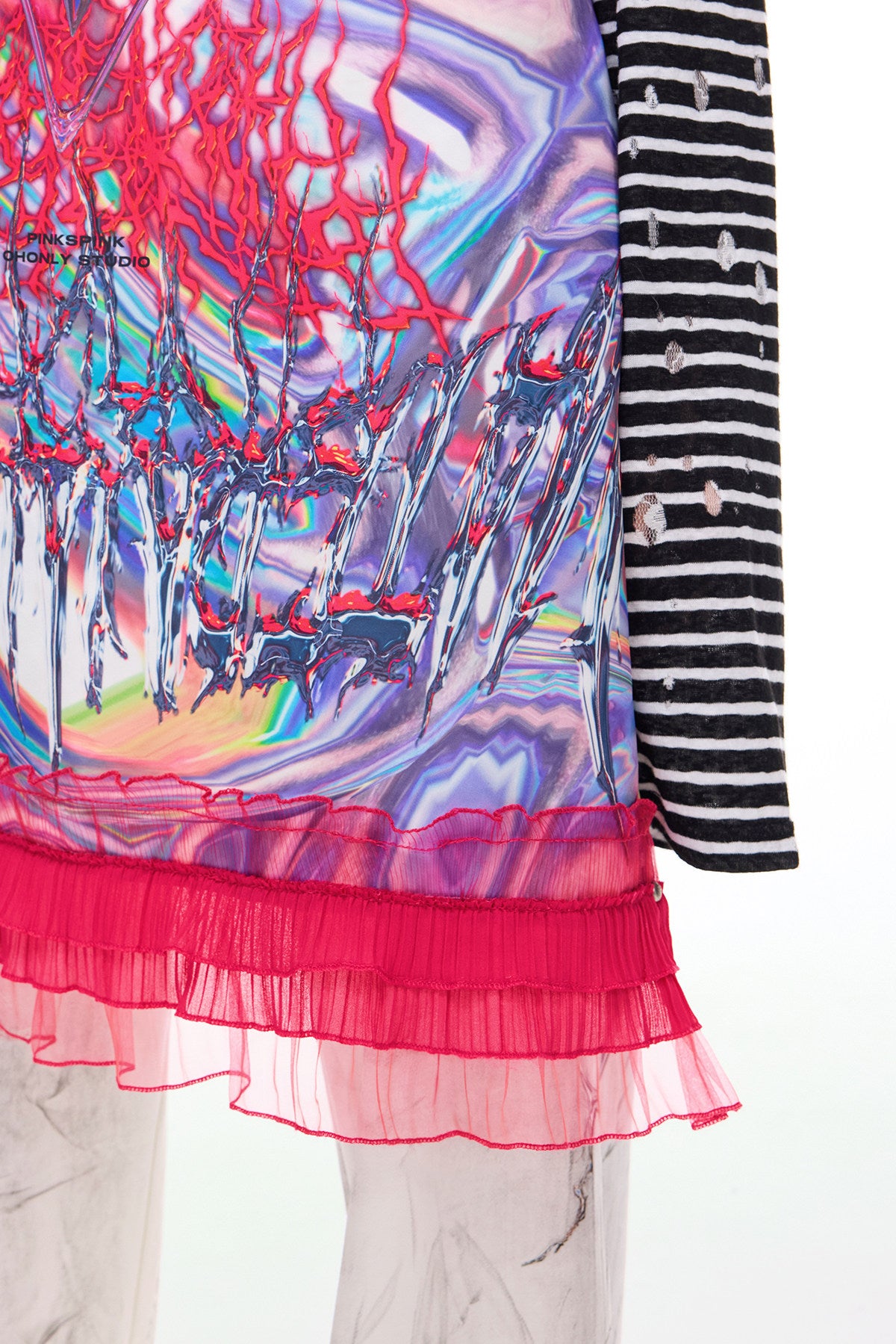PINKSPINK HORNED FROG ruffle-trim layering apron in pink multicolor — close-up of the pink ruffled hem and printed fabric