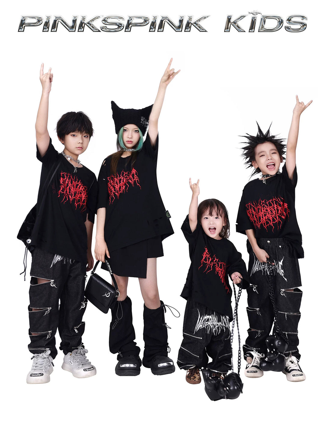PINKSPINK THORN kids distressed logo tee — group modeled front view with raised arms and red thorn logos