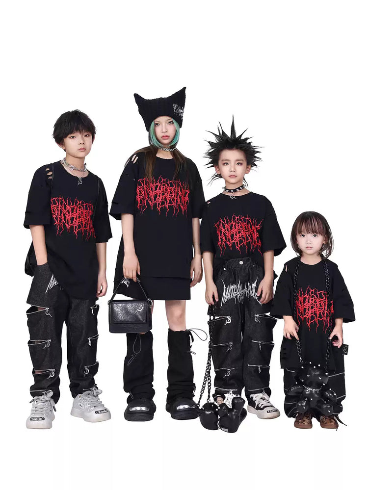 PINKSPINK THORN kids distressed logo tee — group modeled view showing the loose short-sleeve silhouette