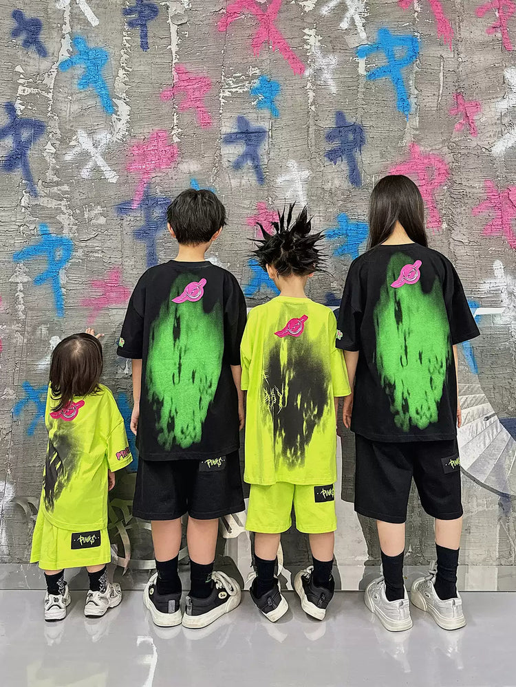 PINKSPINK COLLISION kids graffiti tee and shorts set — group modeled back view showing the graffiti graphics