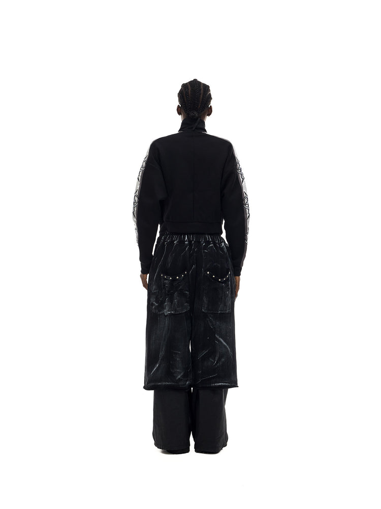 PINKSPINK MIRROR silver-panel zip jacket in black and silver — rear full-length modeled view with trousers