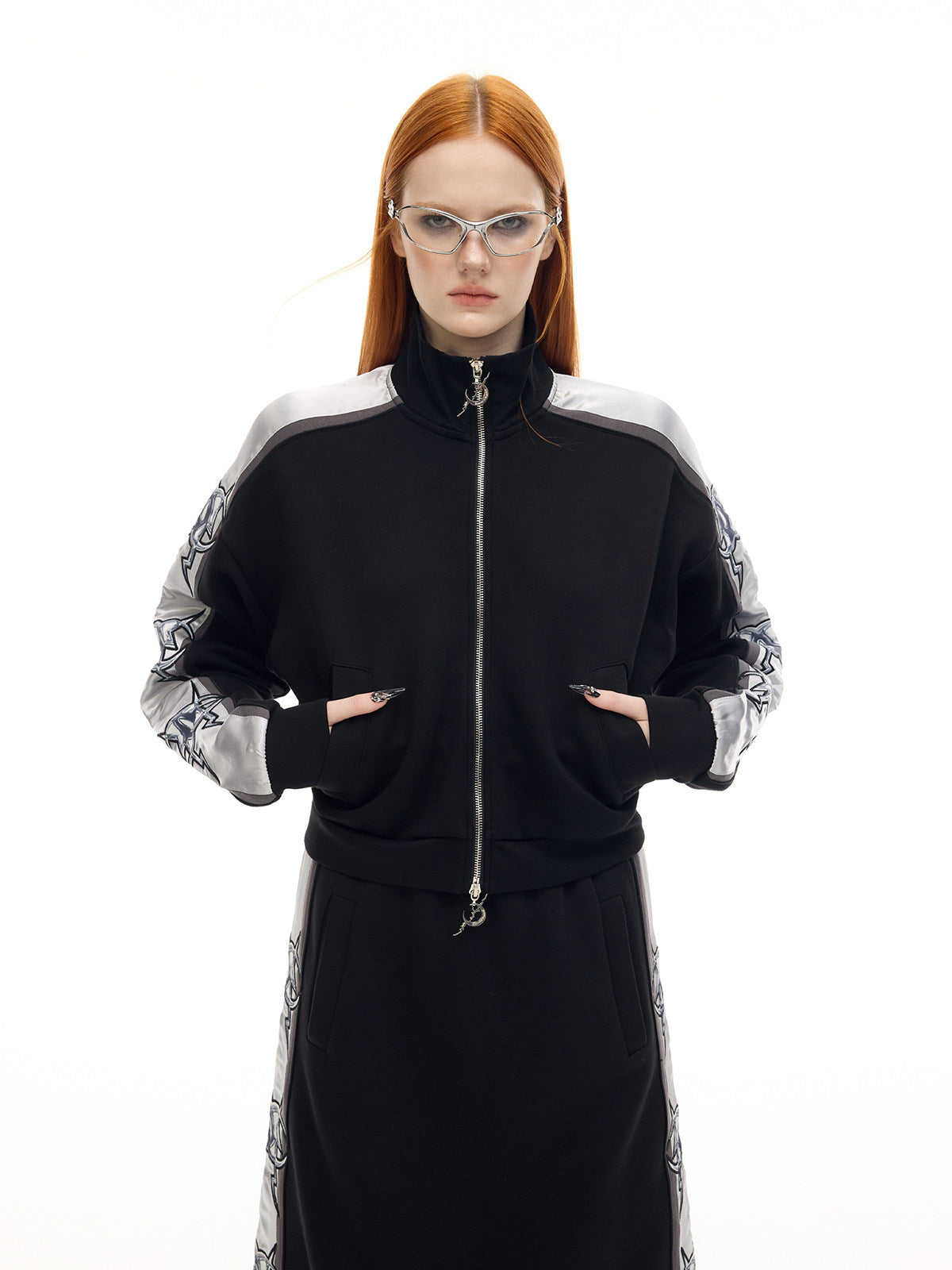 PINKSPINK MIRROR silver-panel zip jacket in black and silver — front modeled close-up showing the pockets and double zipper