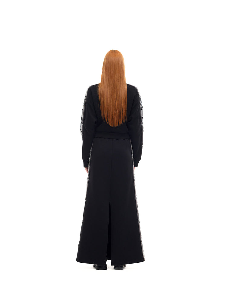 PINKSPINK MIRROR silver-panel maxi skirt in black and silver — rear full-length modeled view showing the back split