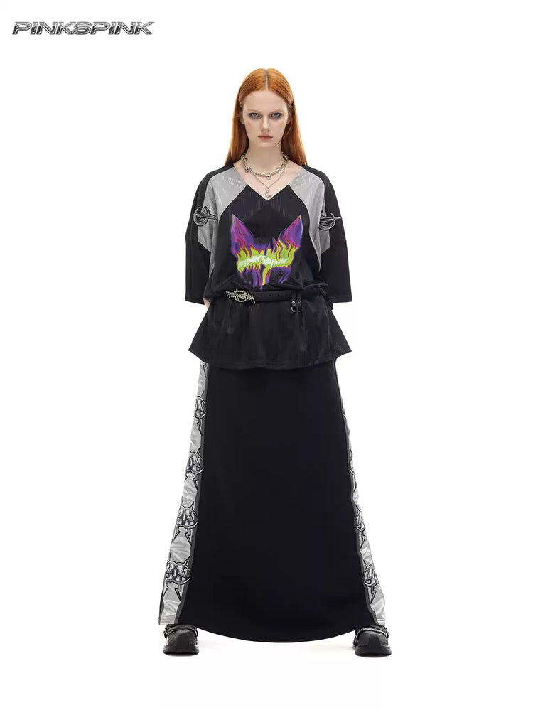 PINKSPINK MIRROR silver-panel maxi skirt in black and silver — front full-length modeled view with hands in pockets
