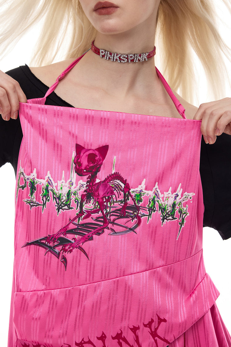 PINKSPINK asymmetric graphic halter dress in pink — close-up of the halter strap and skeletal cat graphic