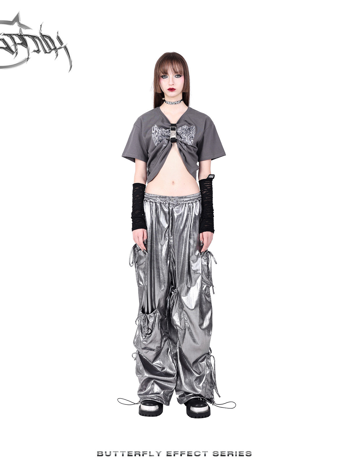 PINKSPINK BUTTERFLY EFFECT metallic bow-pocket cargo pants — silver straight-on full-body view with a gathered gray top.