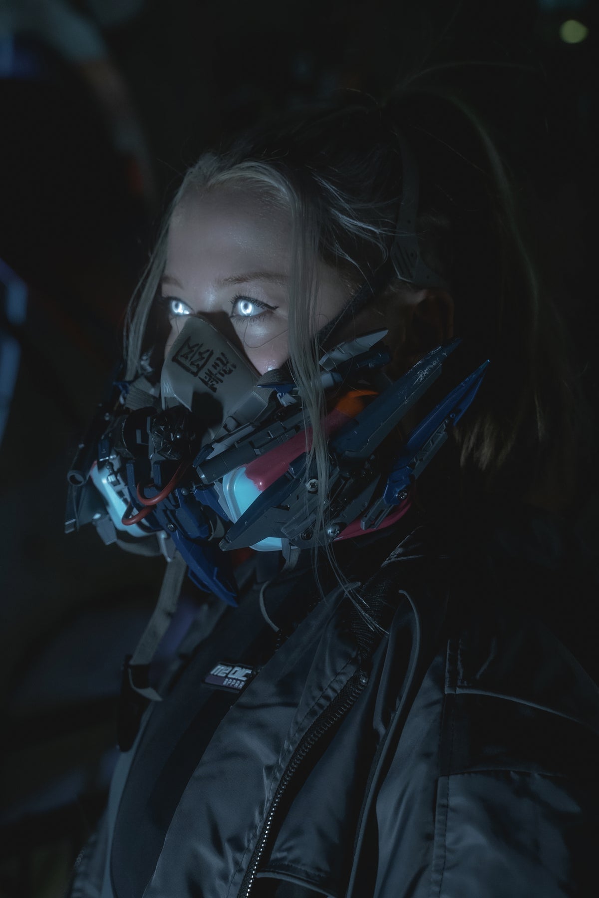 Dragon Star Red Zone tactical portrait with illuminated eyes and cybernetic respirator
