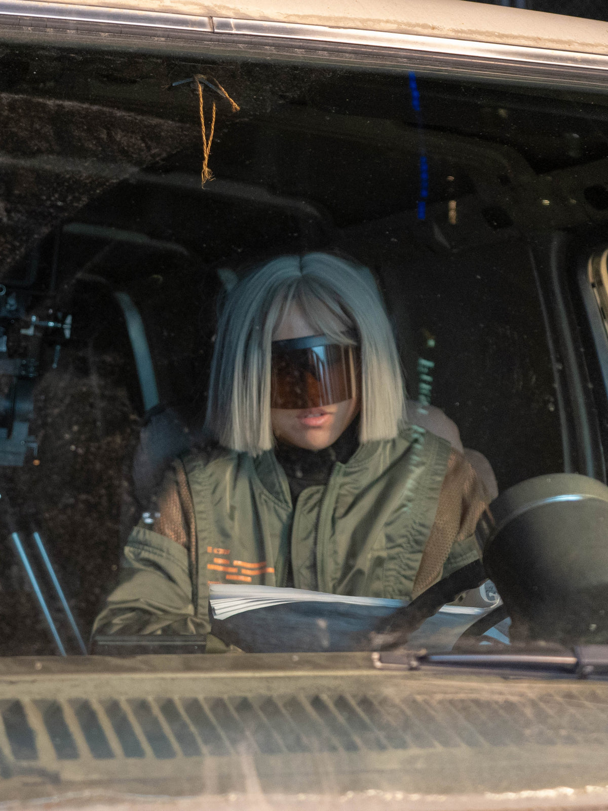 Red Zone character inside a Curfew vehicle