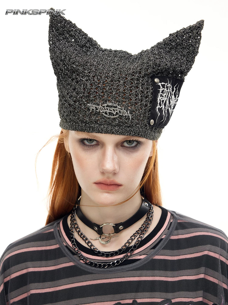 PINKSPINK DEVILCAT distressed cat-ear knit beanie in black — front modeled close-up showing the knit and patch