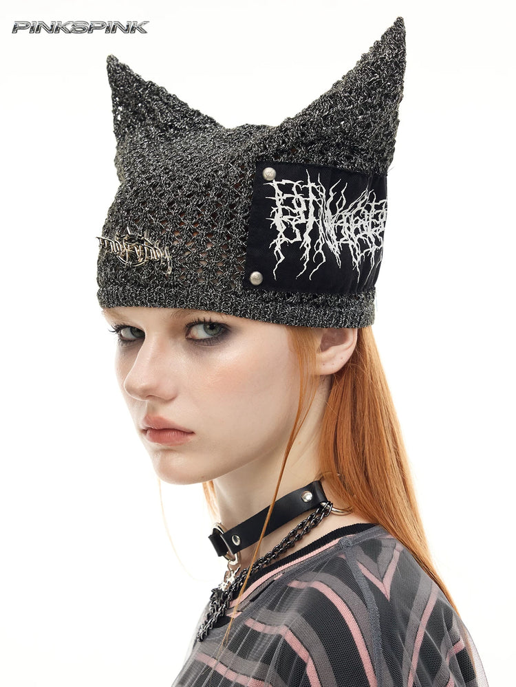 PINKSPINK DEVILCAT distressed cat-ear knit beanie in black — three-quarter modeled close-up showing the ear shape