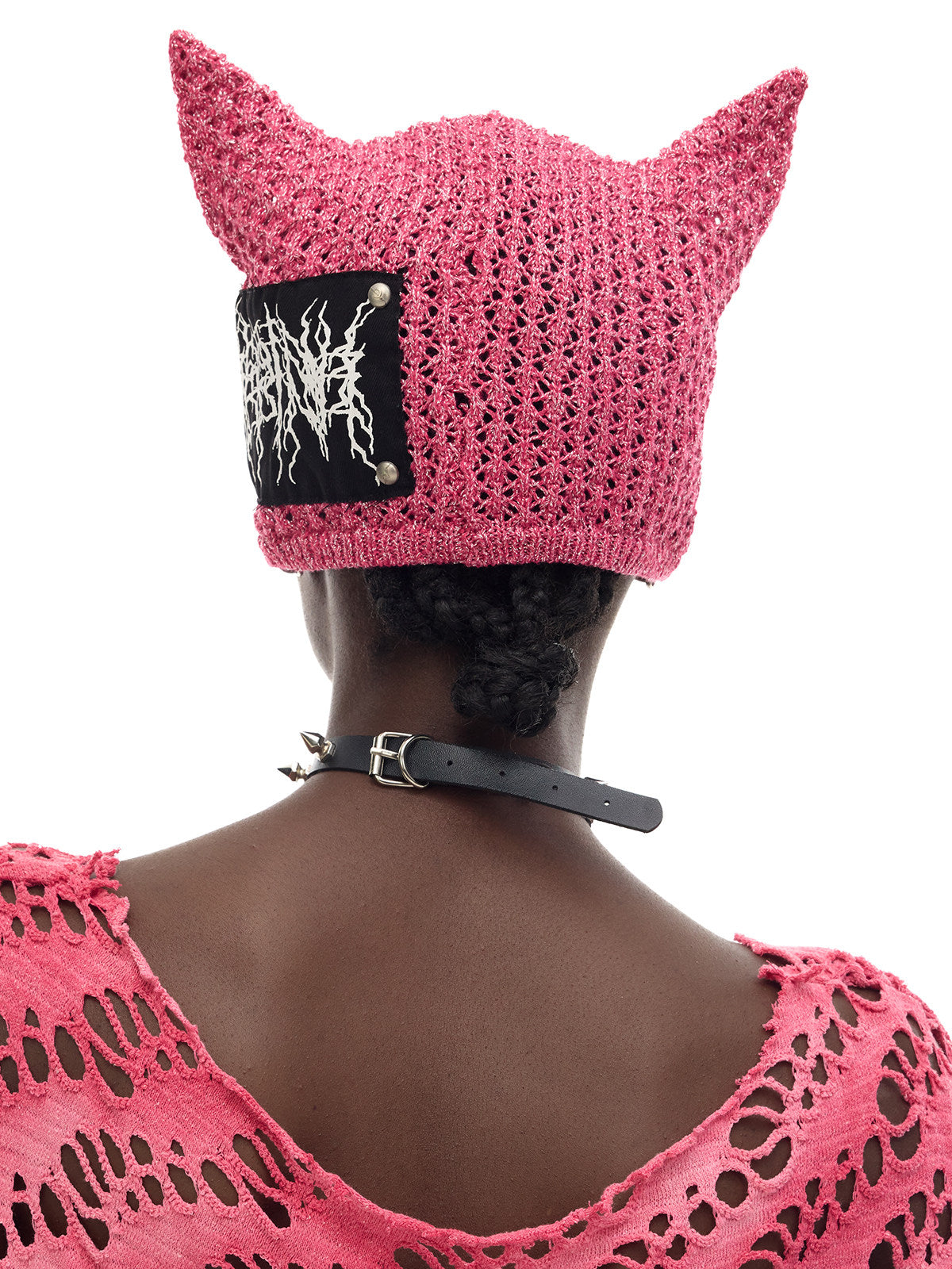 PINKSPINK DEVILCAT distressed cat-ear knit beanie in pink — back modeled close-up showing the contrasting patch